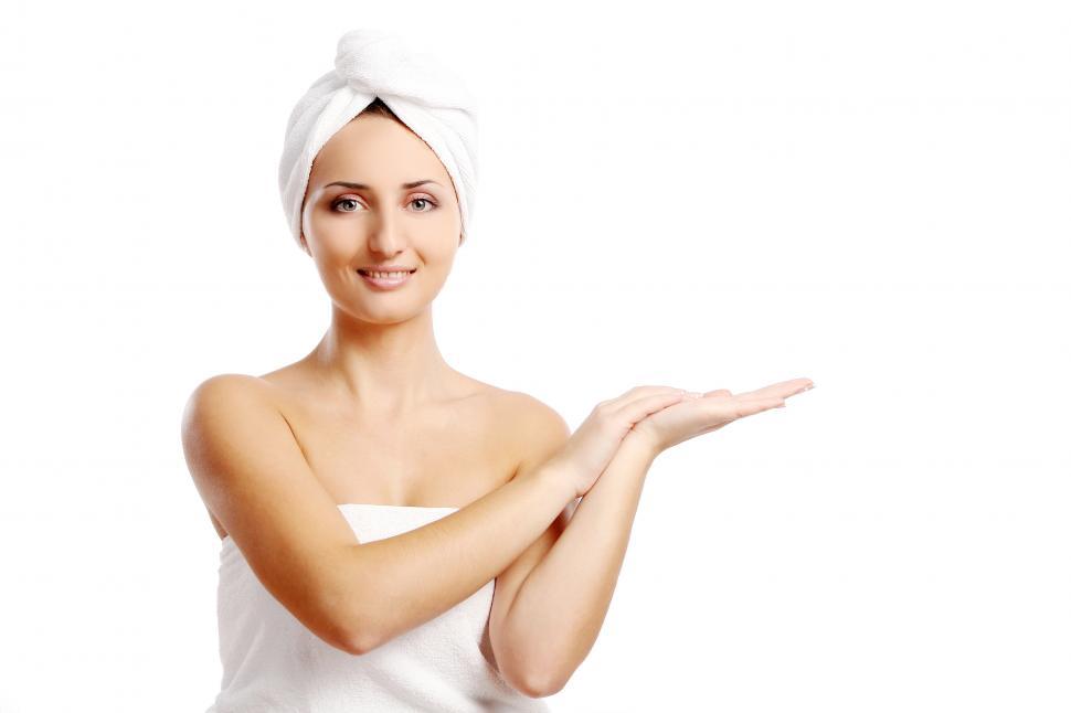 Free Image of young woman on a white background, wearing towels 