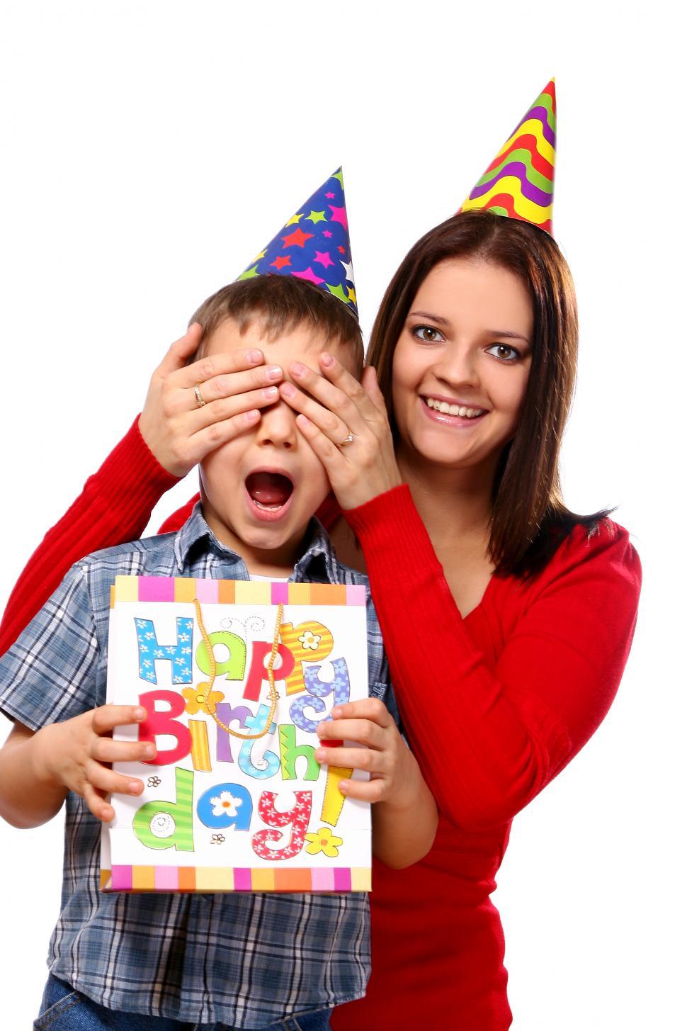 Free Image of young mother with son - covering eyes in party hat 
