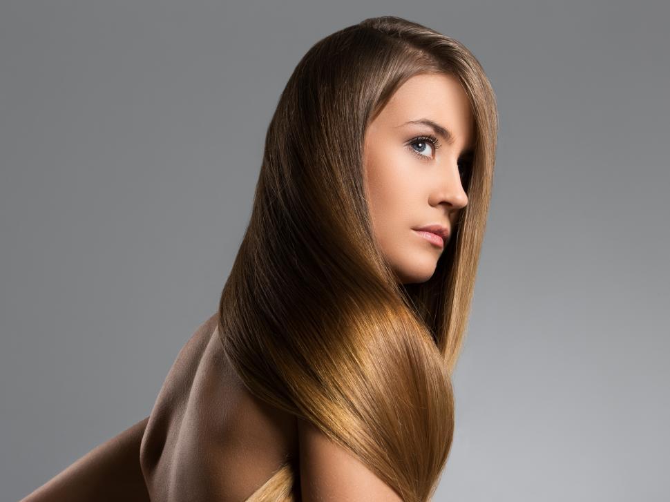 Free Image of Woman wrapped in her own very long hair 