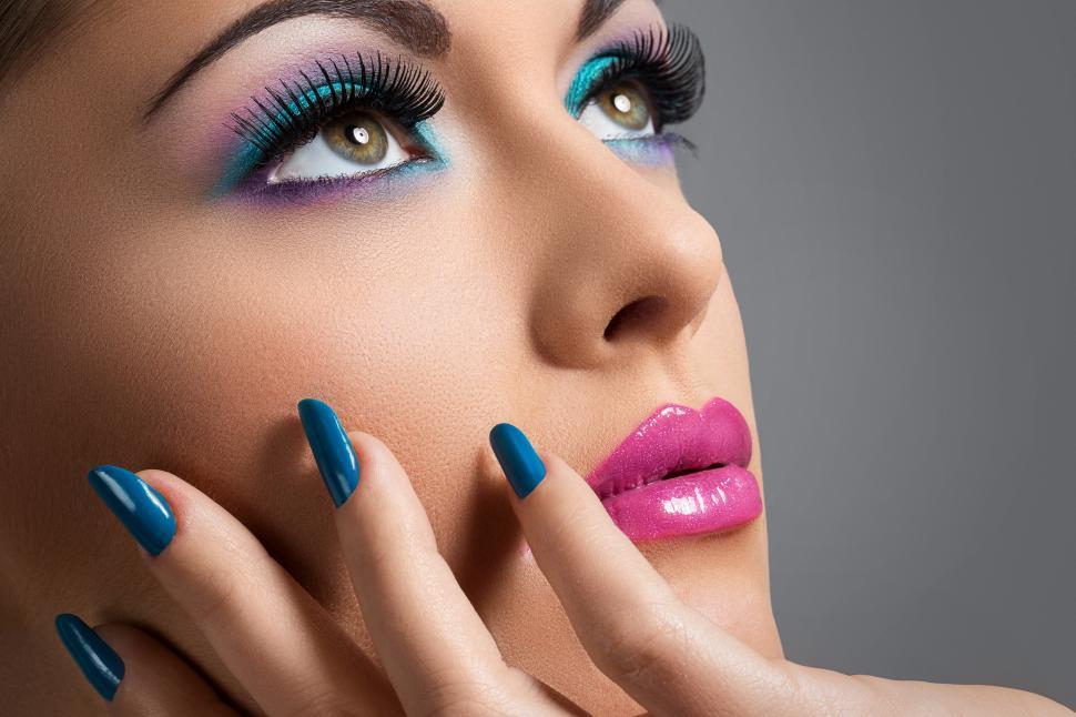 Free Image of Beautiful woman with colorful makeup, looking up 
