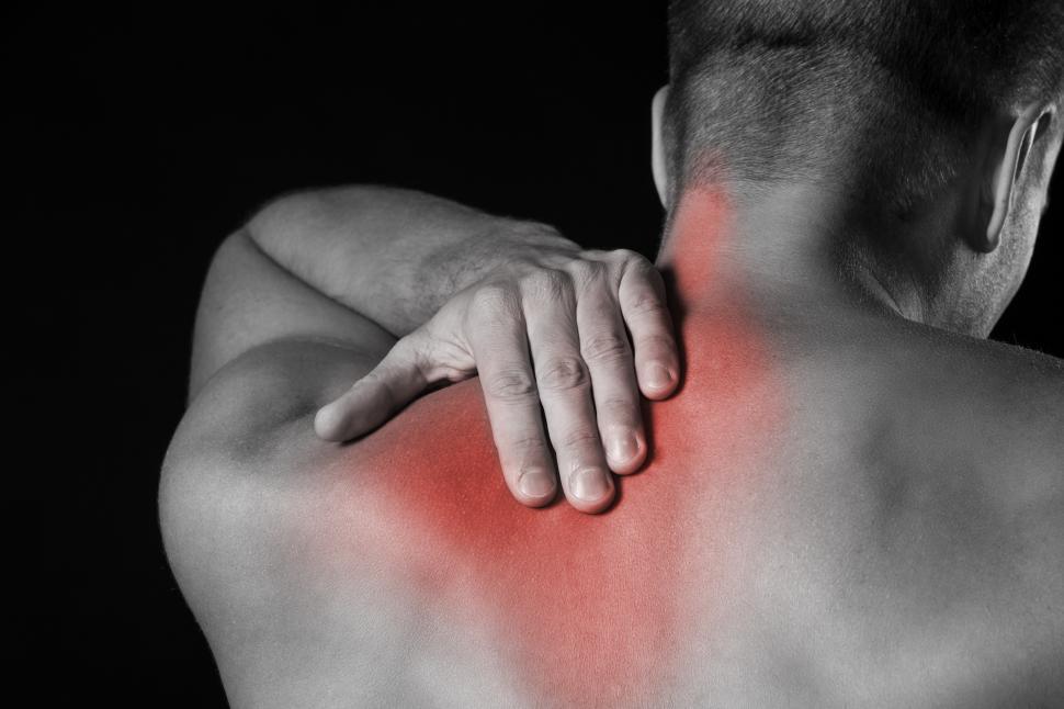 Download Free Stock Photo of Man with shoulder and upper back pain 