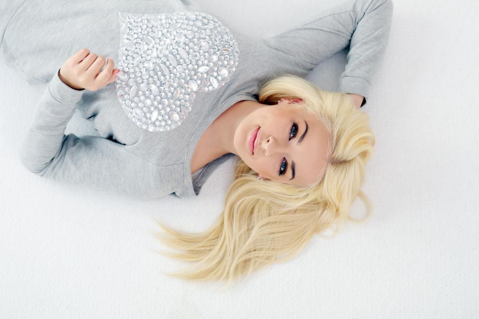 Free Image of Blonde woman laying on the floor 