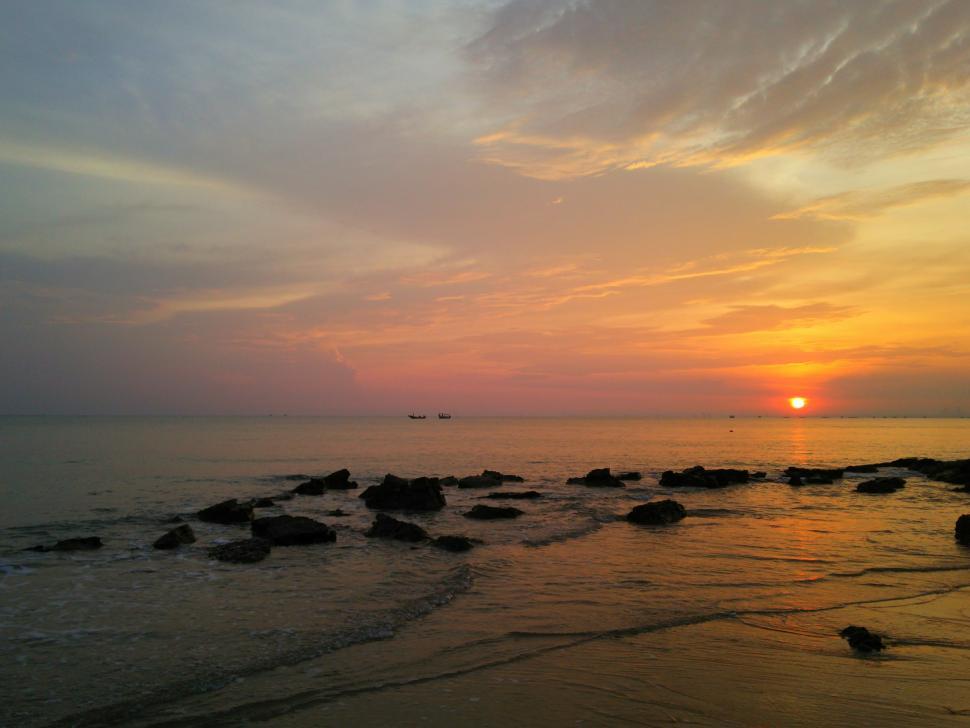 Free Image of Sunrise on the rocky sea  