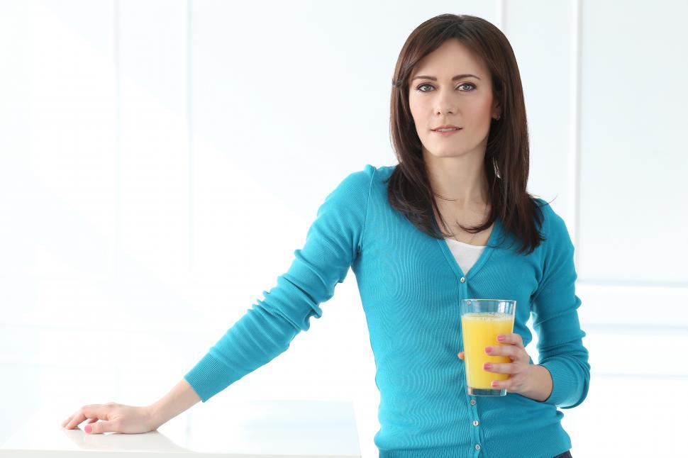 Free Image of Woman with orange juice 