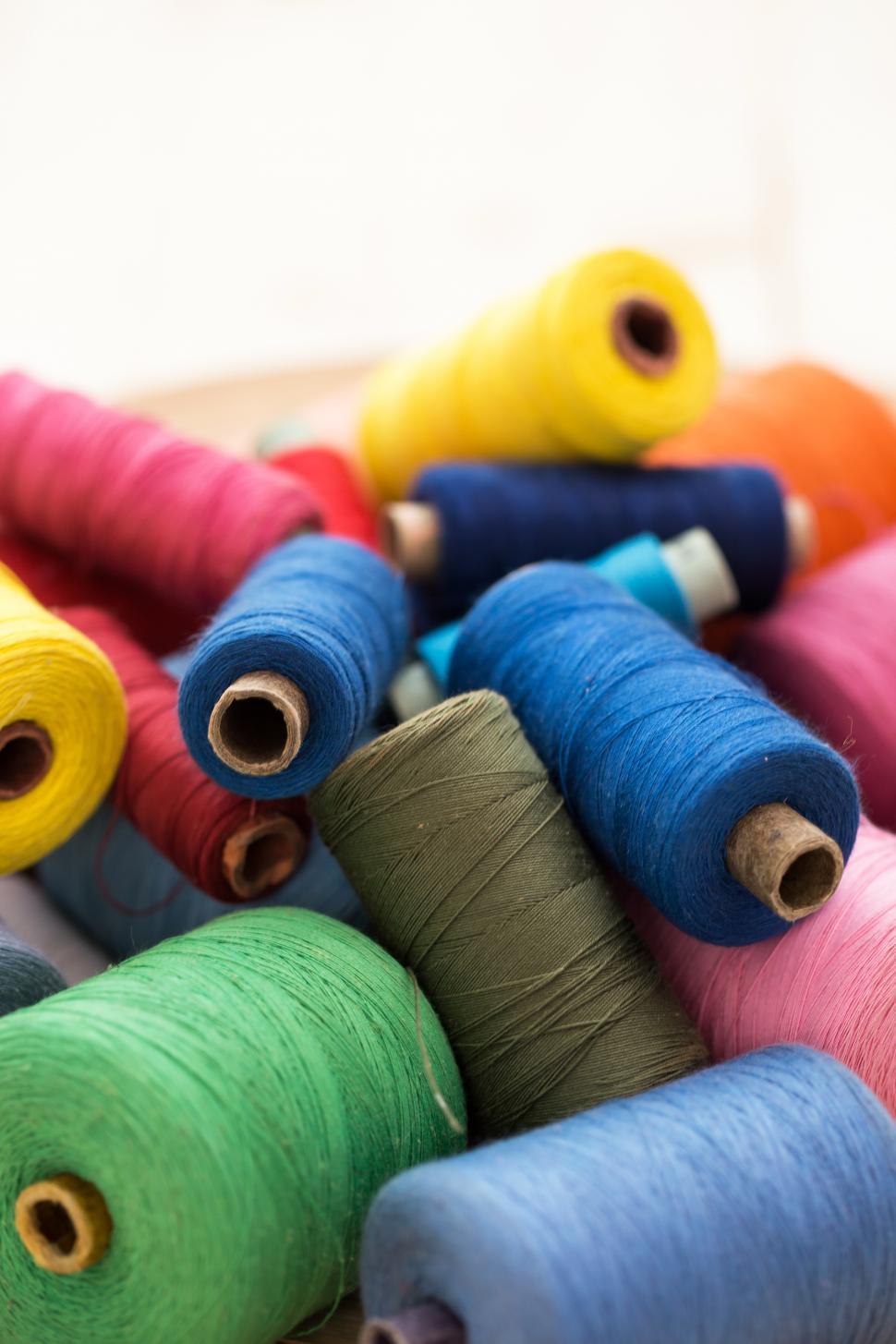 Download Free Stock Photo of Colorful threads on the table 