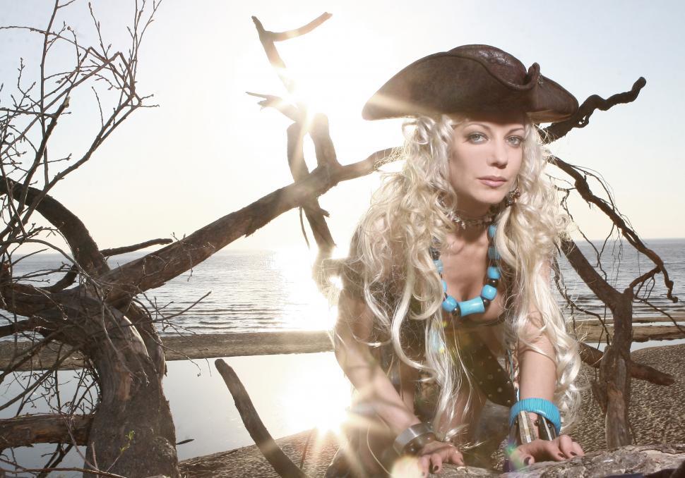 Download Free Stock Photo of blonde woman in pirate outfit on the beach 