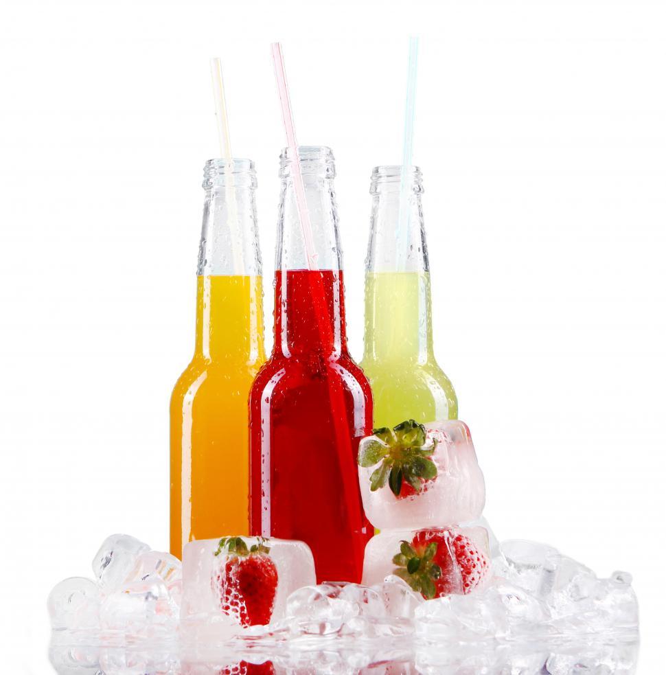 Free Image of Colorful drinks with straws on a white background 