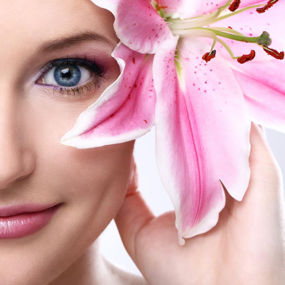 Free Image of Beautiful woman with pink lily flower 