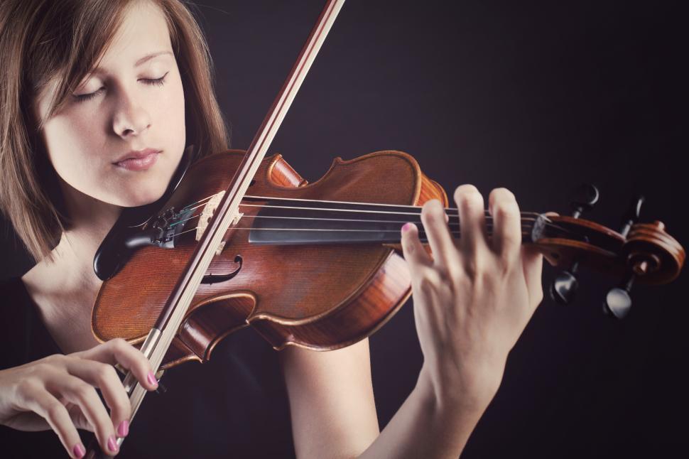 Free Image of Young musical woman with a violin 