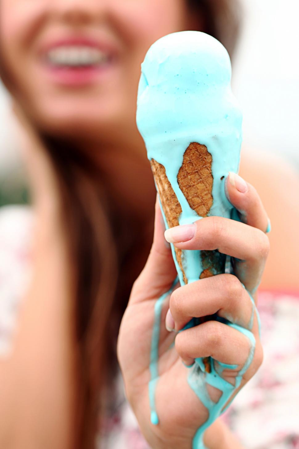Download Free Stock Photo of Woman with melting ice cream cone 