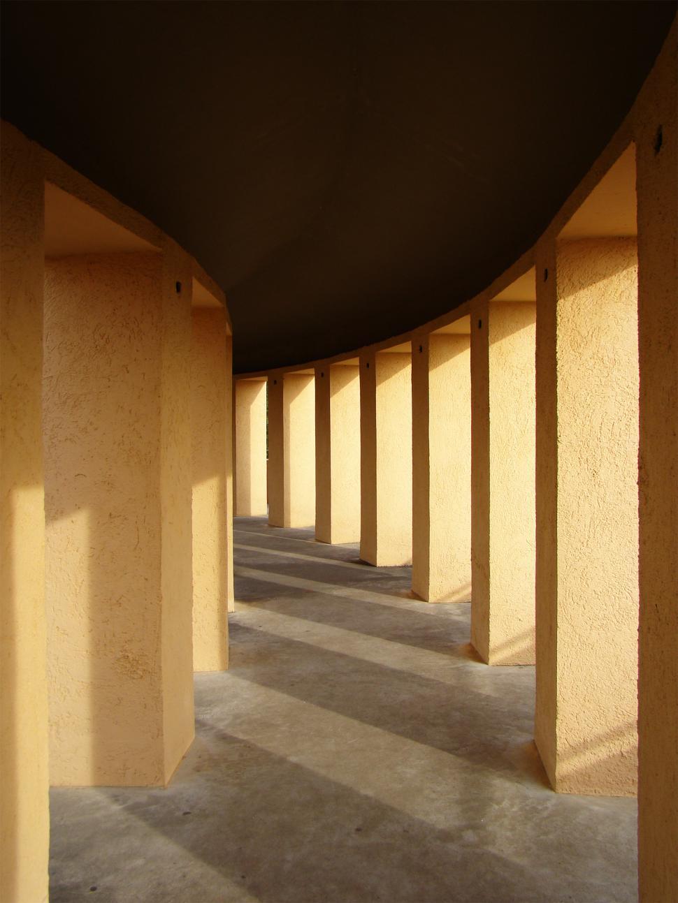 Free Image of Long Row of Concrete Pillars in a Building 