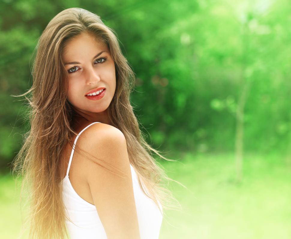Free Image of Young woman in the lush park 