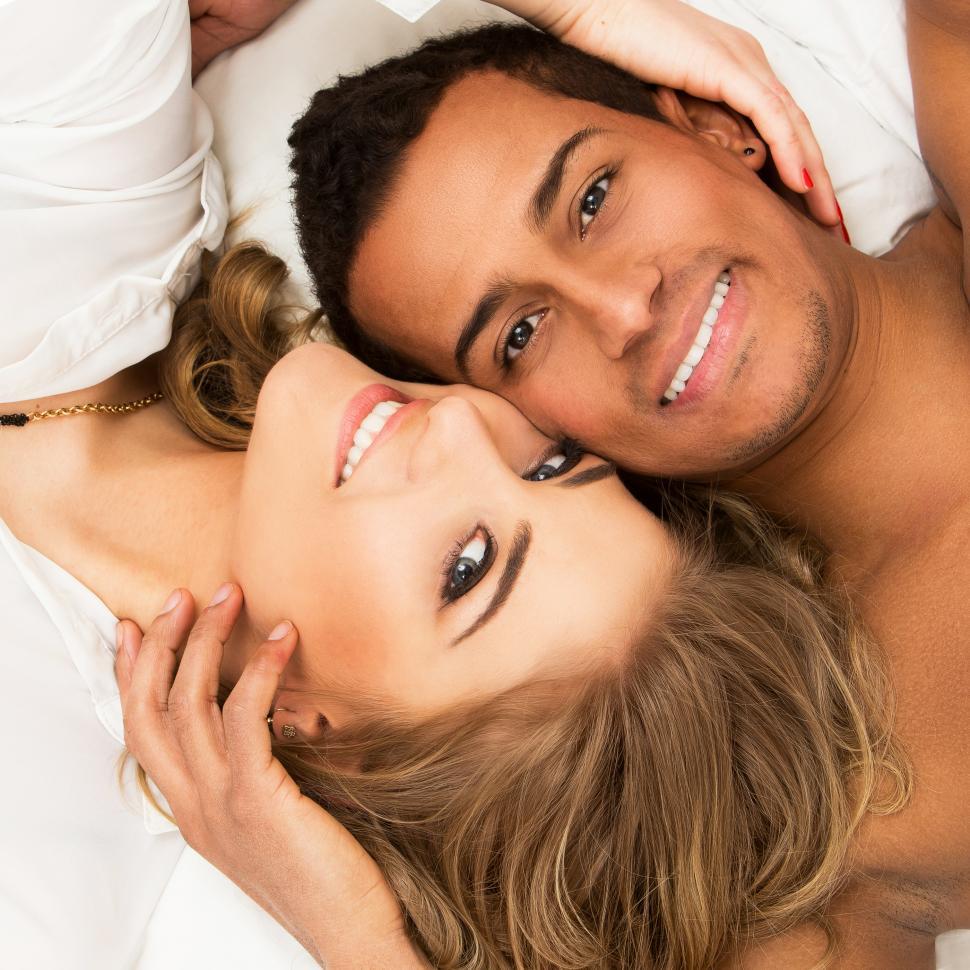 Free Image of Lovely couple in the bed, heads together 