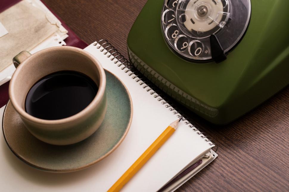 Free Image of Coffee, notebook and a retro phone 