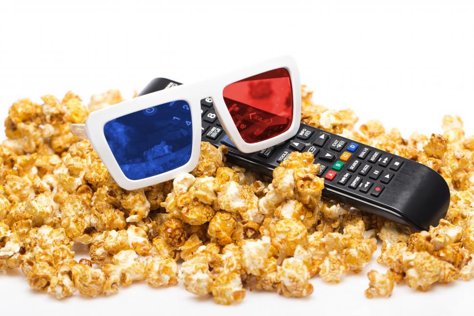 Free Image of Movie viewing - Delicious popcorn, remote and 3-d glasses 