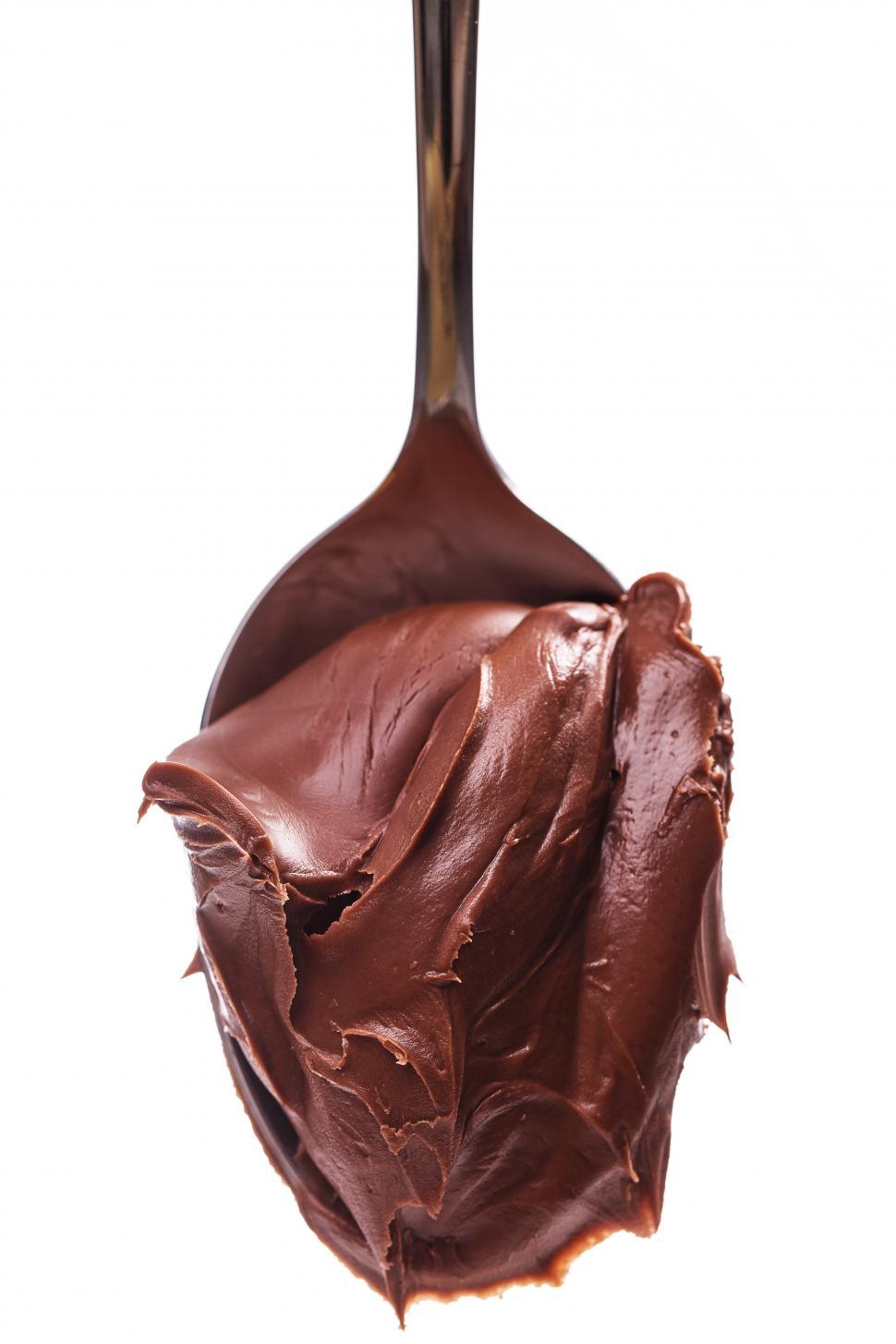 Free Image of Delicious chocolate frosting on a spoon 