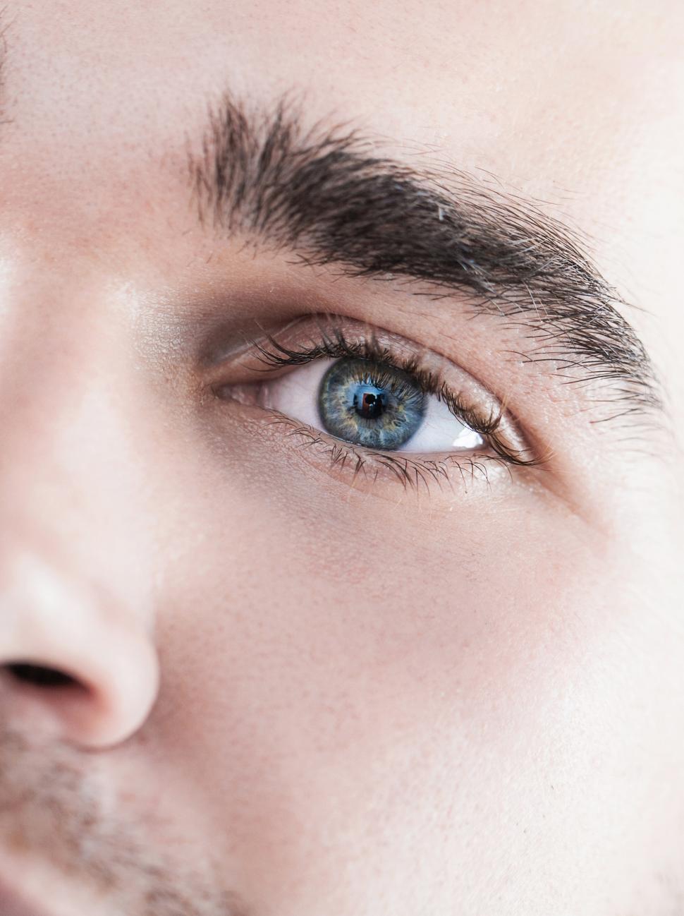 Free Image of Close-up. Man with clean skin, one eye visible 