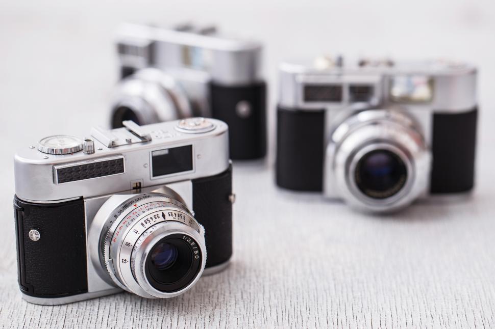 Free Image of Three retro cameras on white background 