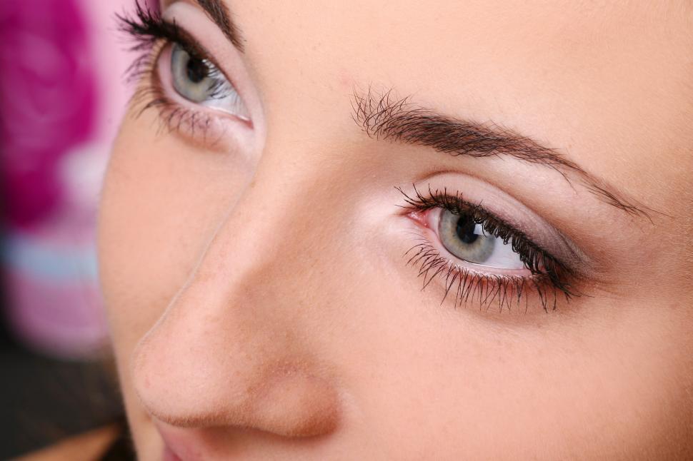 Free Image of Close up on eyes and nose of a young woman 