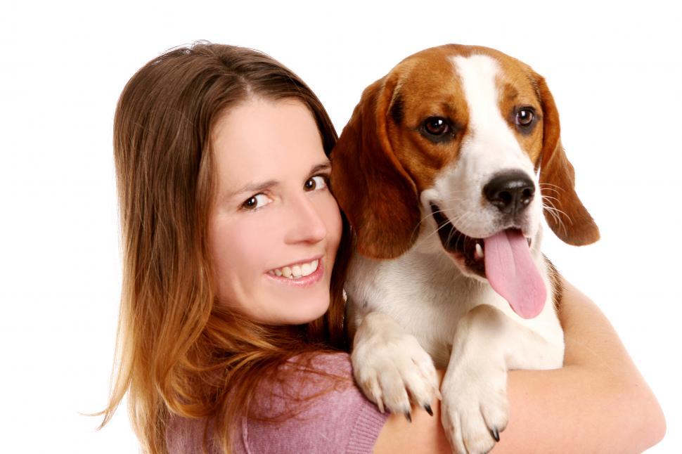 Free Image of Woman holding up her dog 