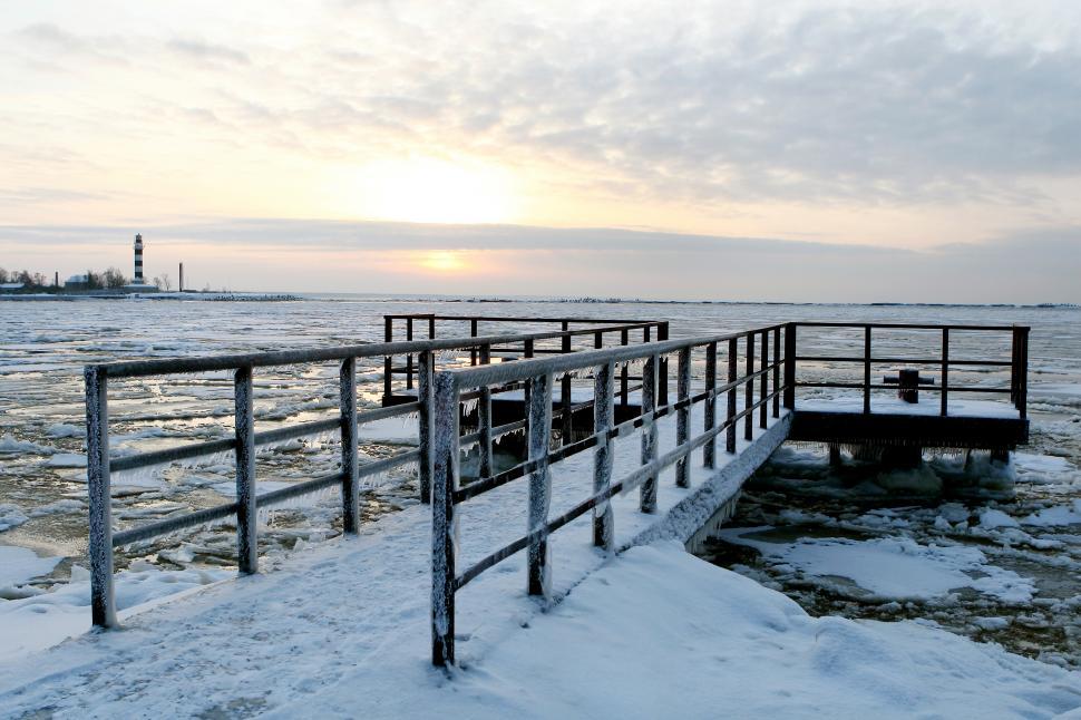 Free Image of Pier covered in winter ice and icicles  