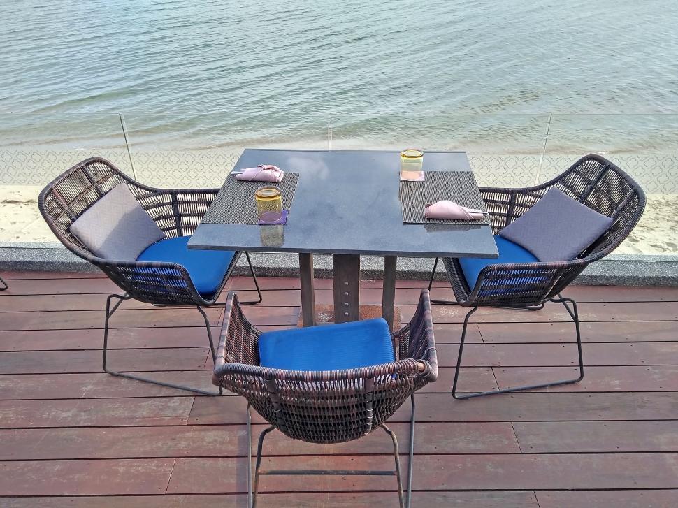 Free Image of Restaurant Table and Chairs on Deck by Ocean  