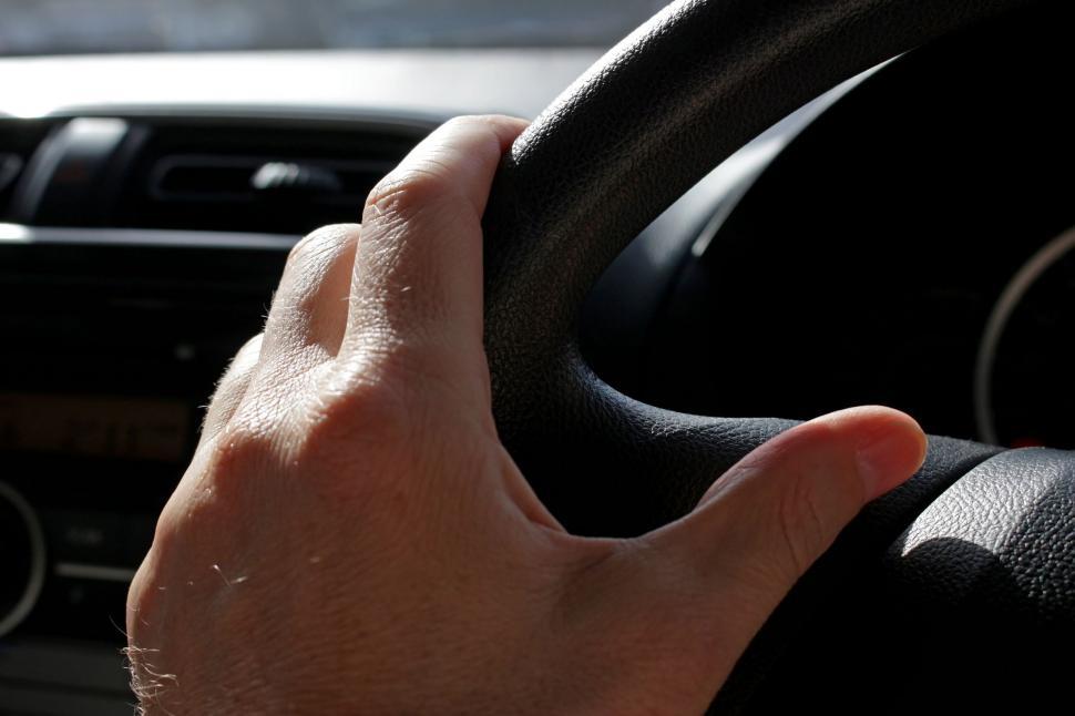 Free Image of Hand on Car Steering Wheel  