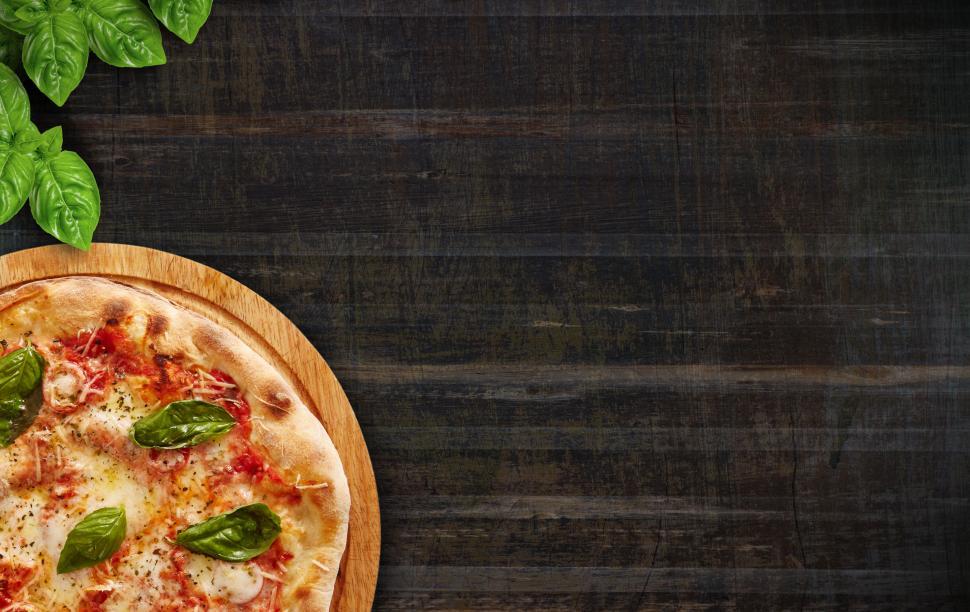 Download Free Stock Photo of Pizza and Basil Leaves on Wooden Background - With Copyspace 