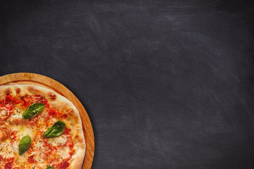Free Image of Delicious Pizza on Dark Table Top - With Copyspace 