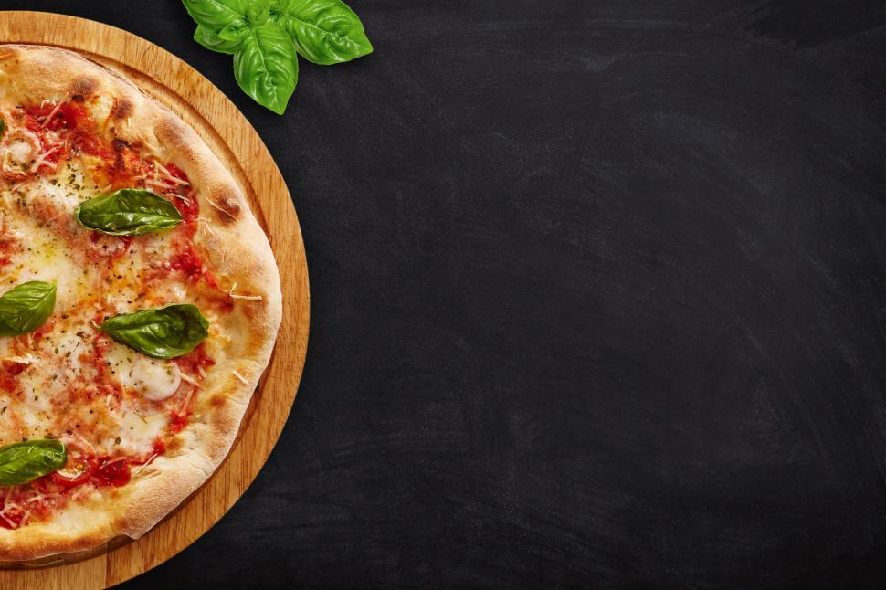 Free Image of Pizza on Dark Table Top Background - With Copyspace 