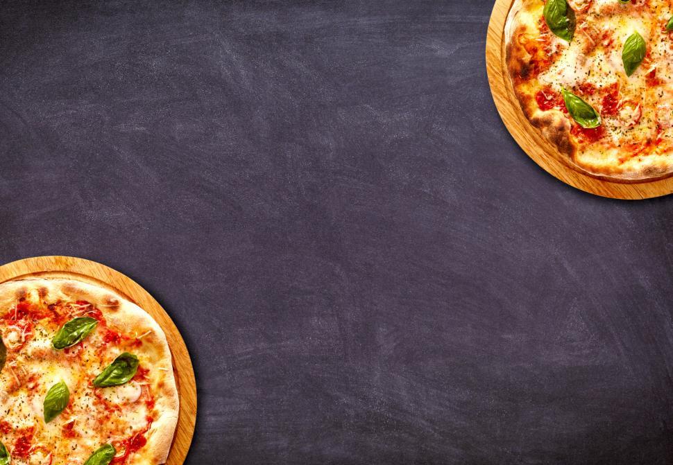 Free Image of Pizzas on Dark Taple Top Background - With Copyspace 