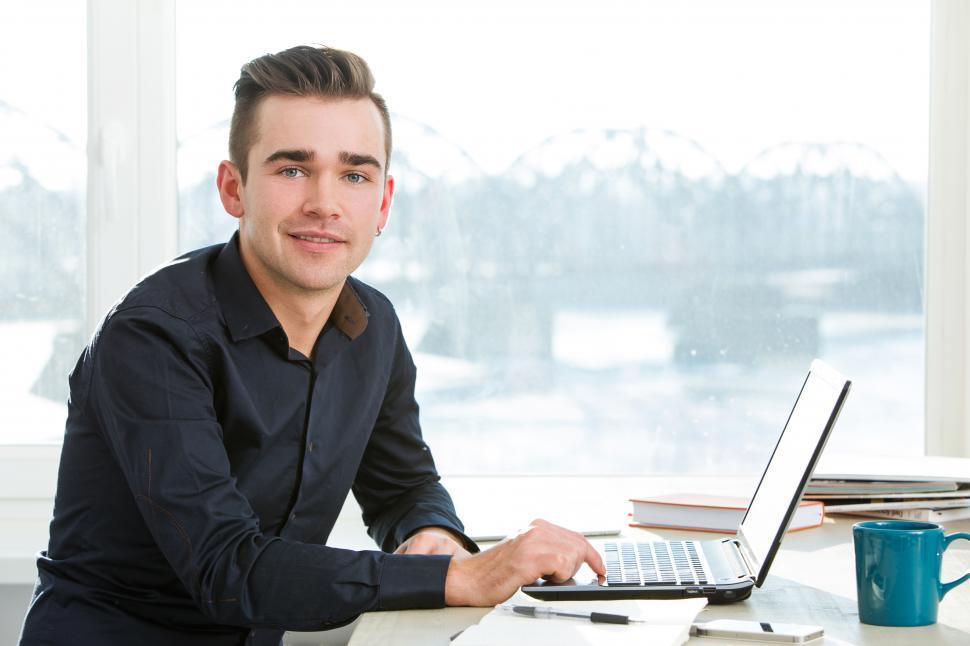 Free Image of Young man at a desk 