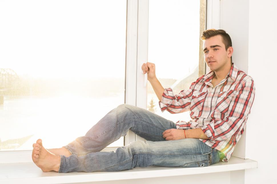 Free Image of Casual guy by the window 