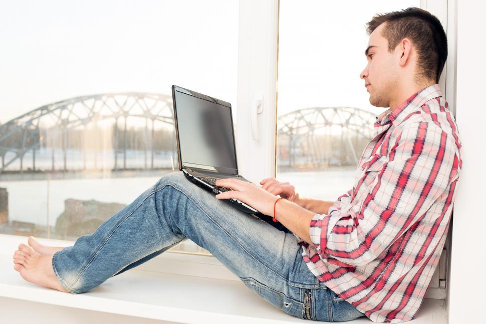 Free Image of Casual guy working on a laptop 