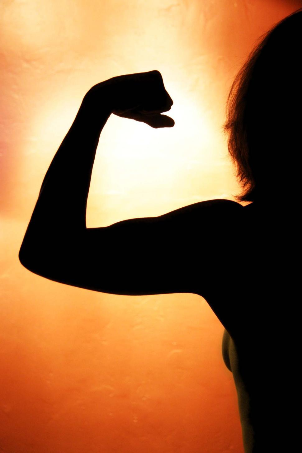 Free Image of Healthy Woman Flexes Muscles 