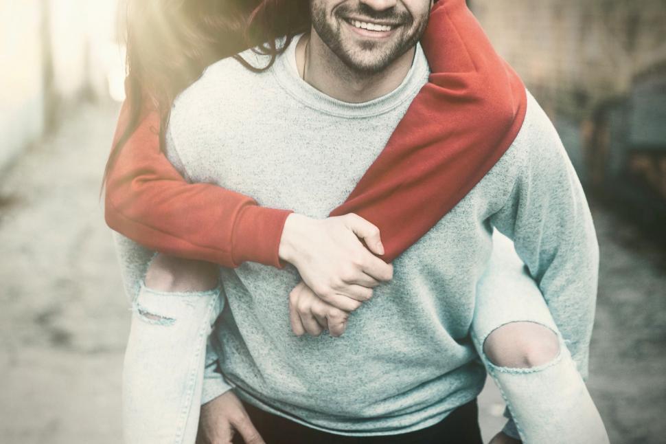 Free Image of Happy Loving Couple - Happy Young Man Piggybacking Girlfriend 