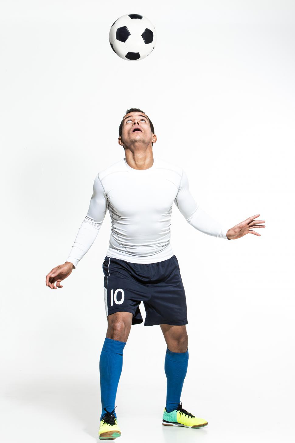 Free Image of Football player juggling with head 