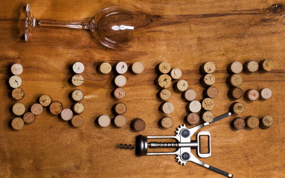 Free Image of Wine corks on the table spell WINE 