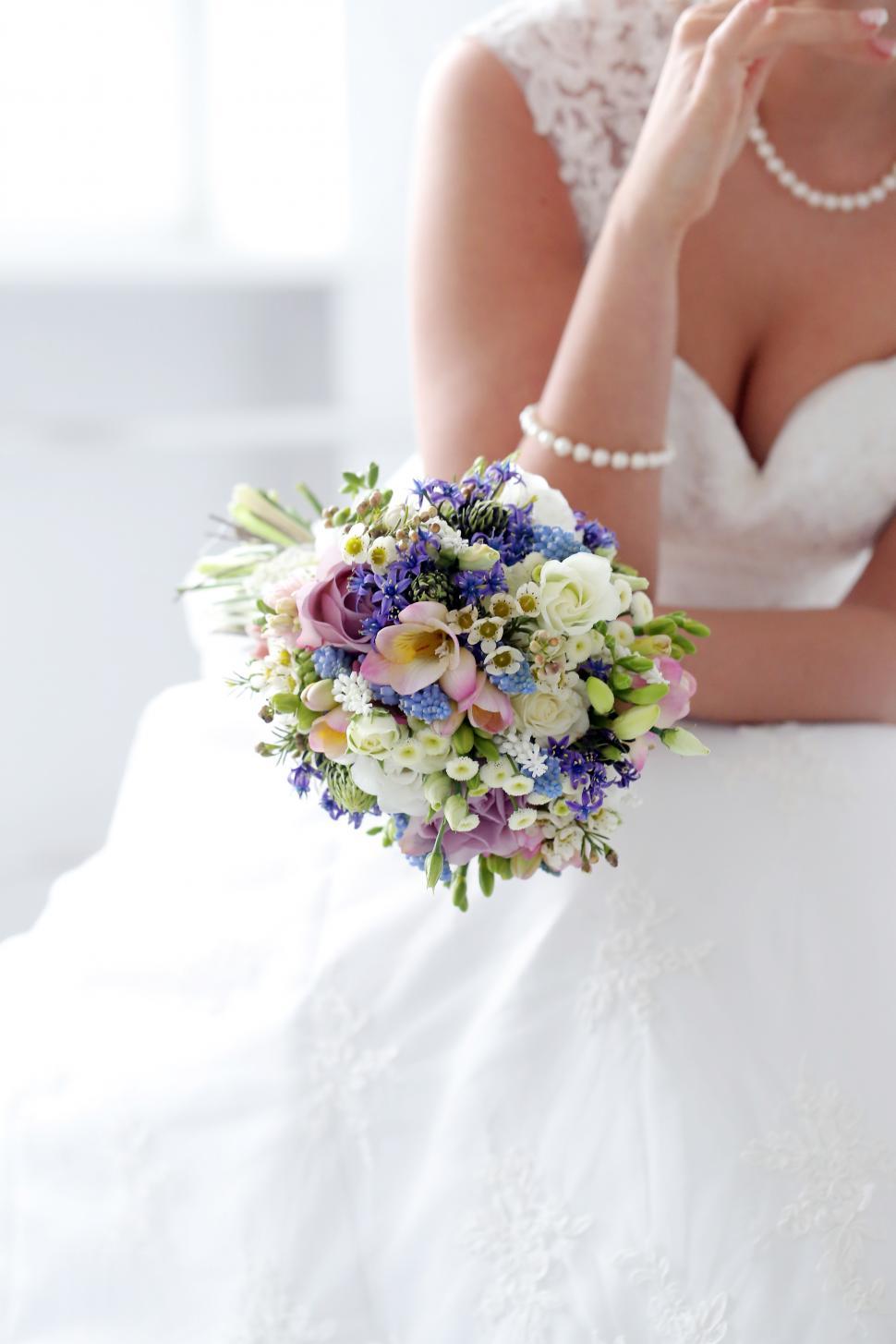 Free Image of Wedding. Beautiful bride in dress with flower bouquet 