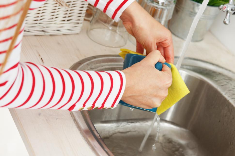 Free Image of Kitchen. Woman washing dishes at the sink 