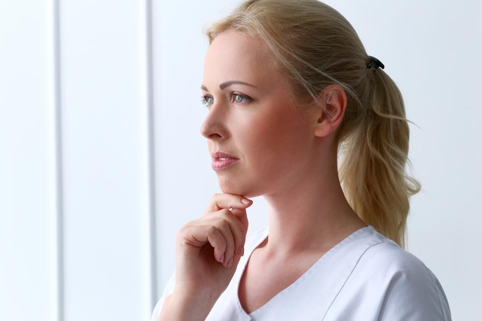 Free Image of Professional woman looking thoughtful 
