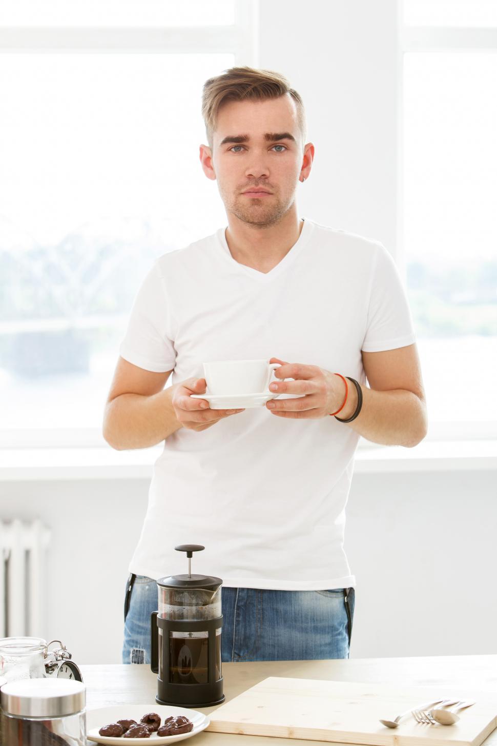 Free Image of Home, morning. Man in the kitchen with coffee 