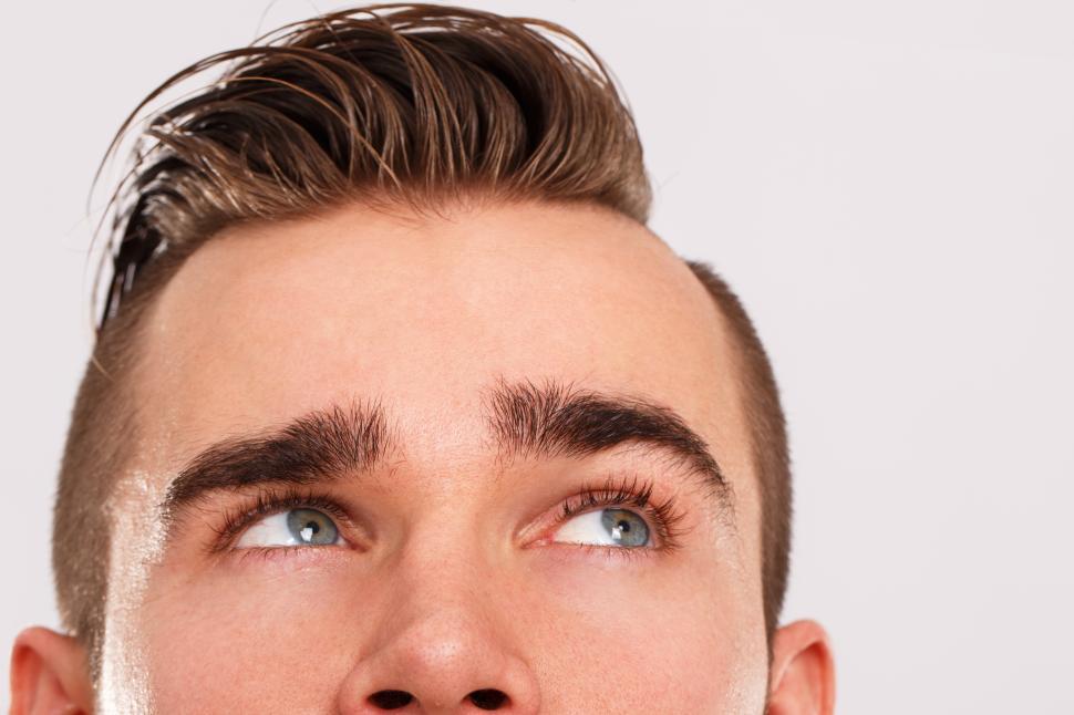 Free Image of Half of a young man's face, looking up 