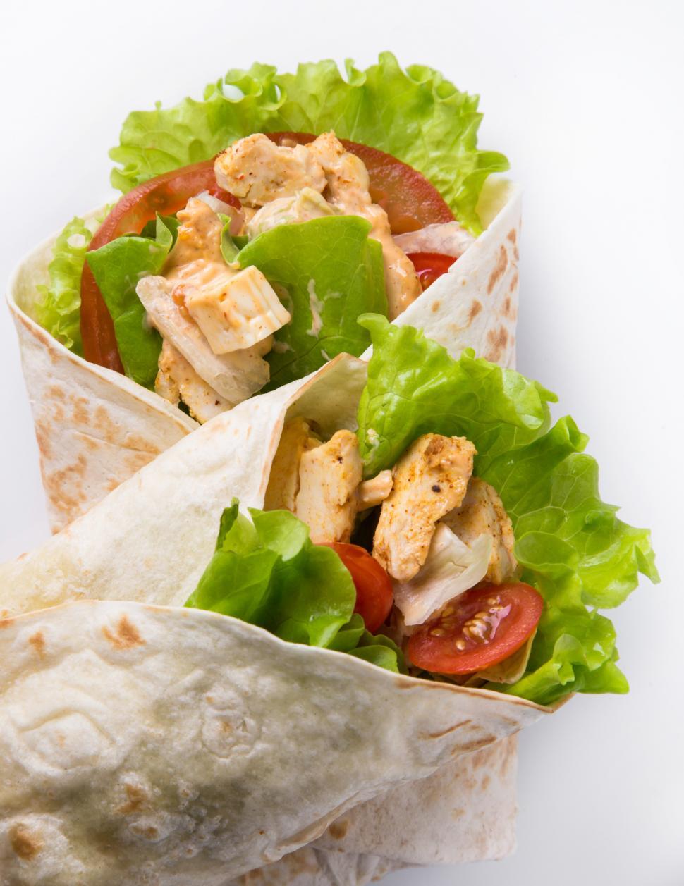 Free Image of Chicken and vegetables wrapped in a tortilla 