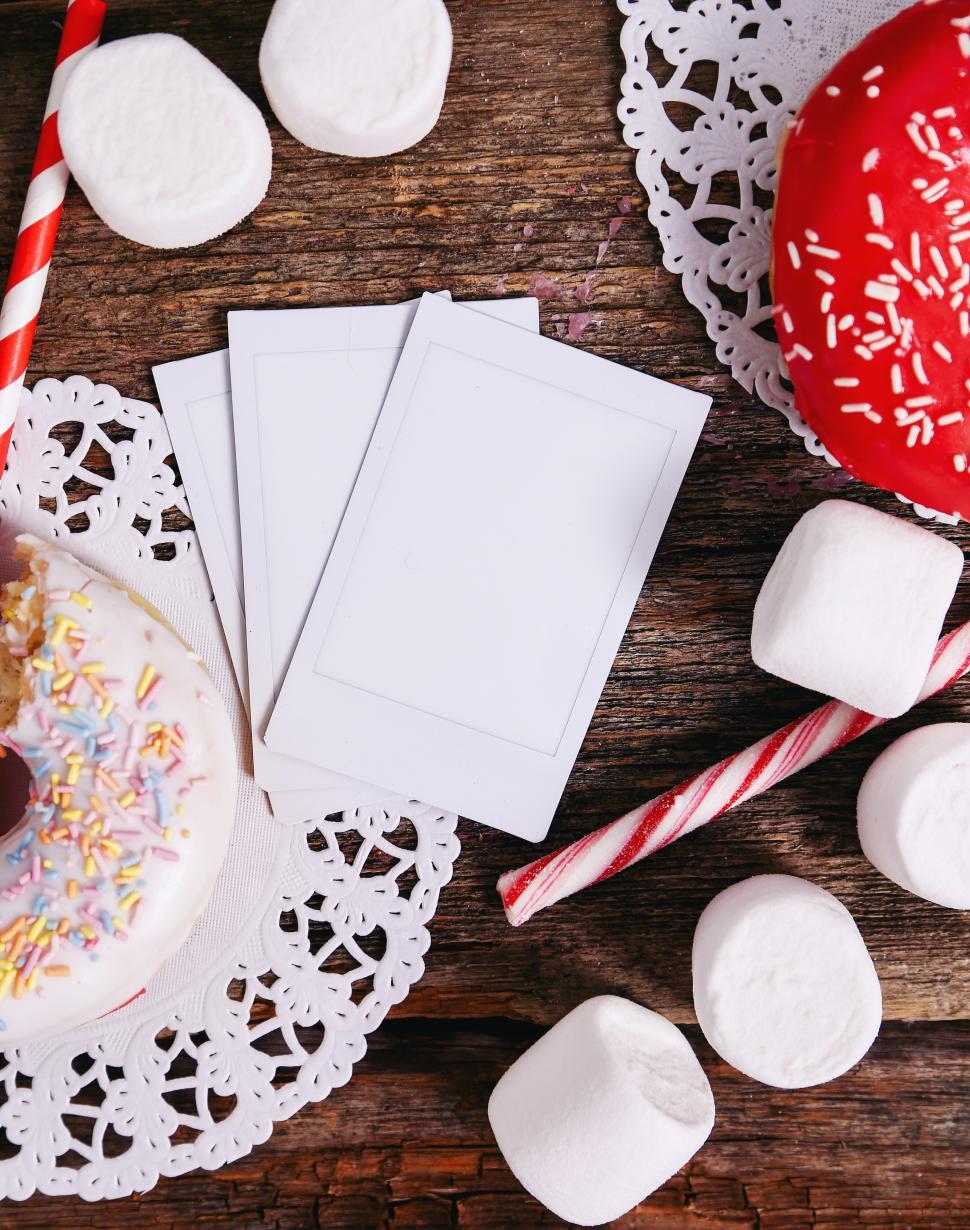 Free Image of Donut and marshmallows and polaroid pictures 