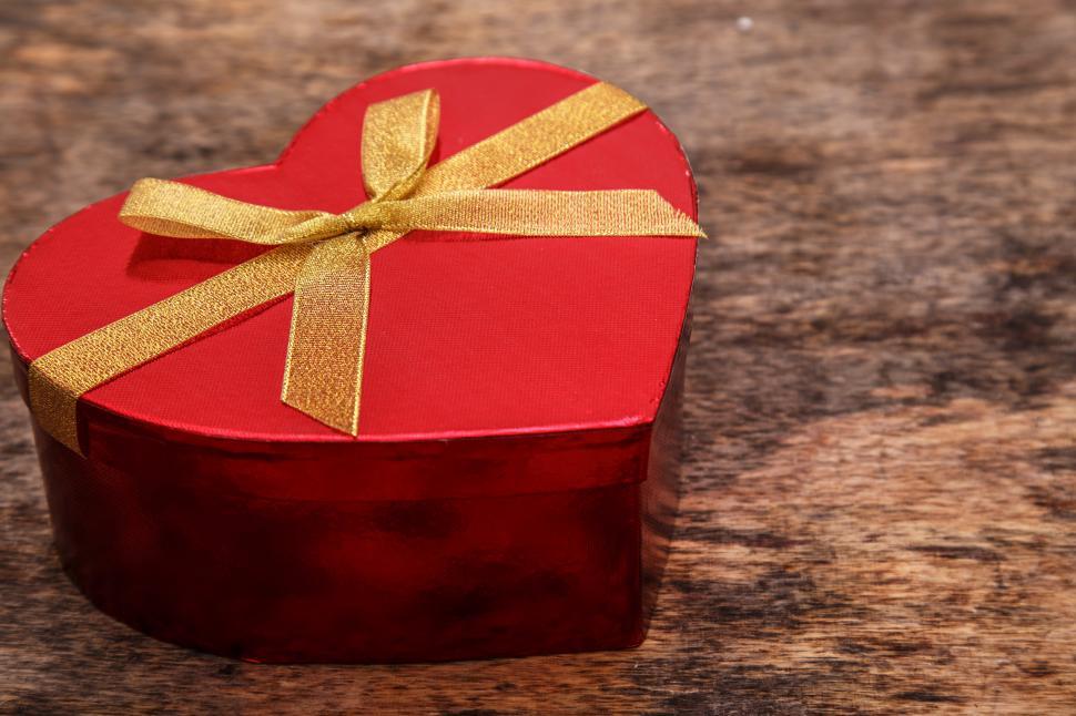 Free Image of Red gift - heart shaped box with gold ribbon 