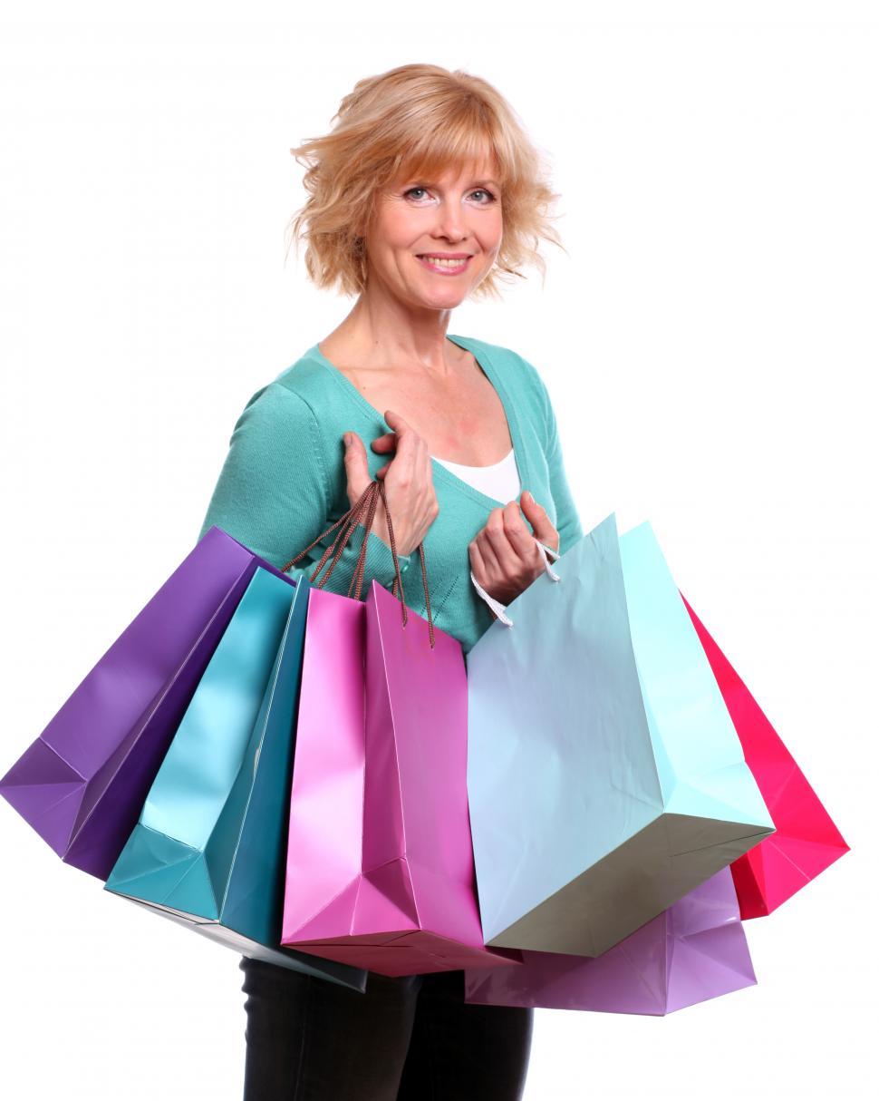 Free Image of Middle aged woman with shopping bags 