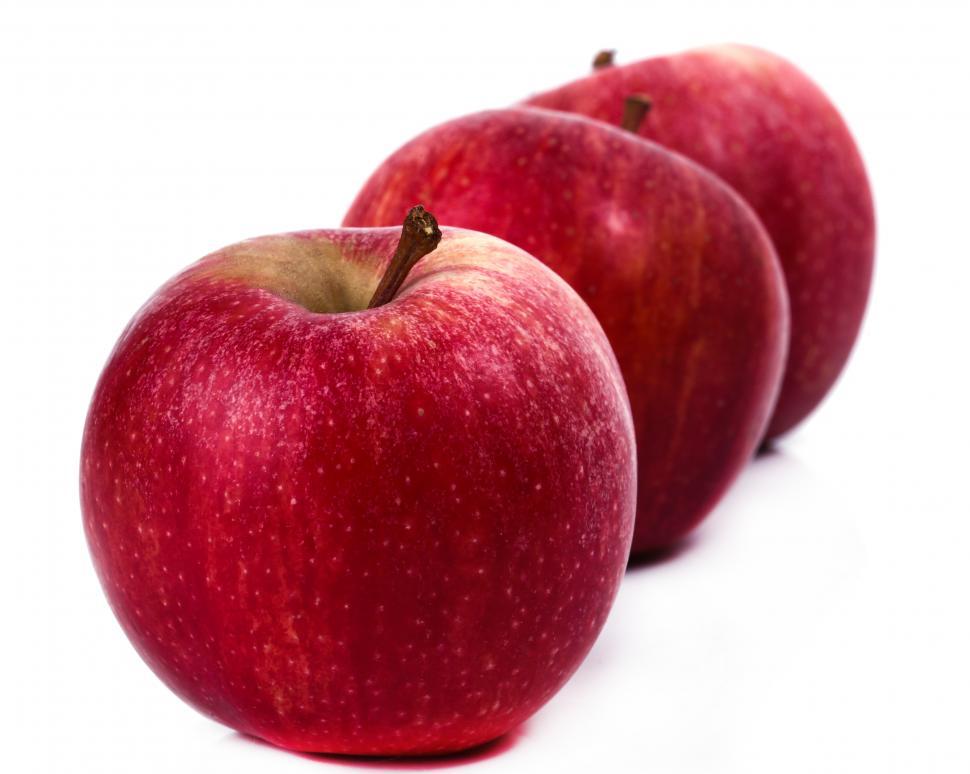 Free Image of Three delicious apples in a row 
