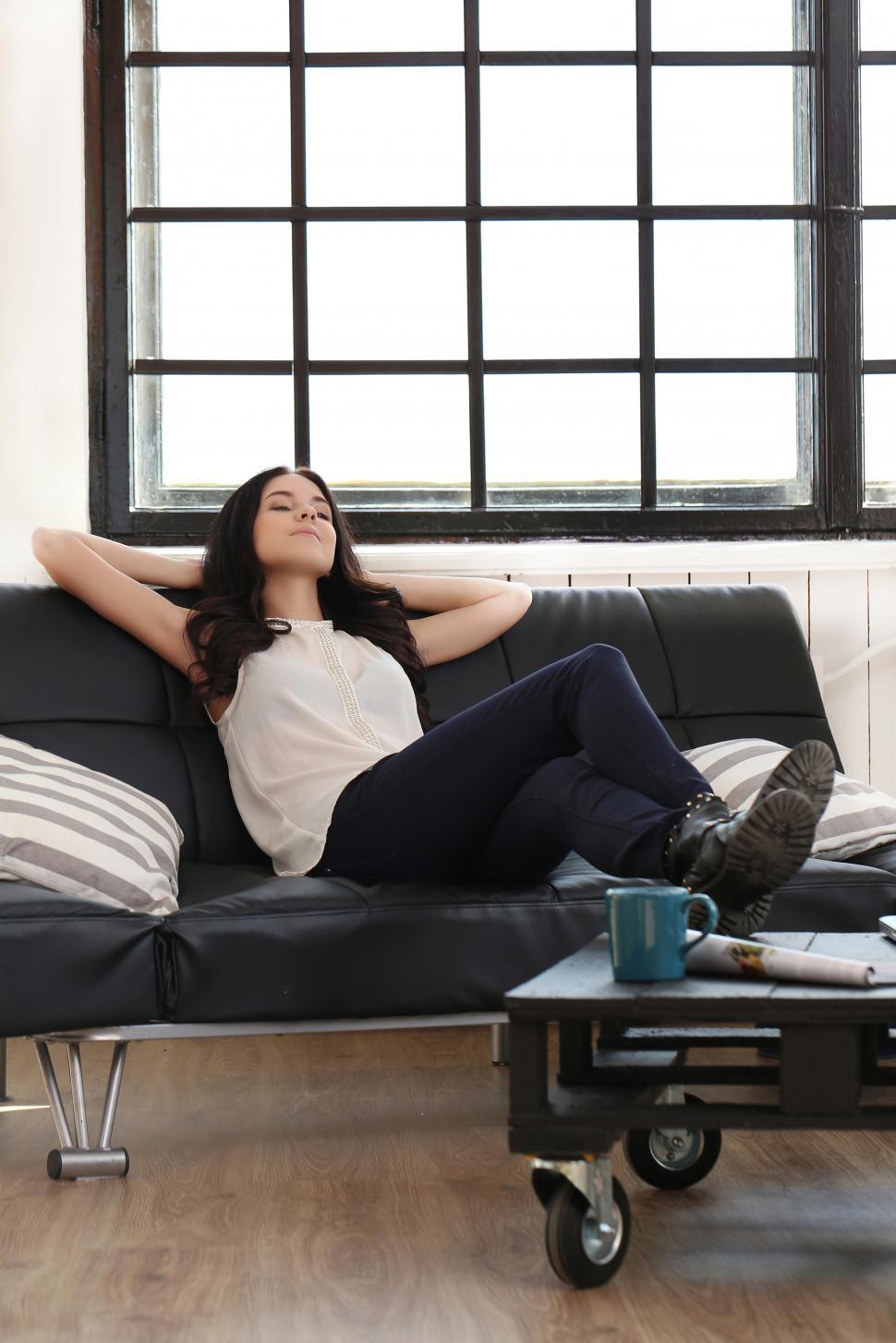 Free Image of Woman relaxing in a modern casual office or home 