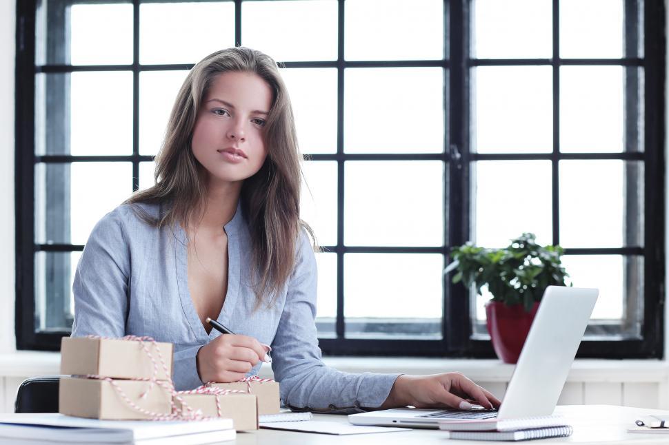 Free Image of Attractive woman at a desk in an office 